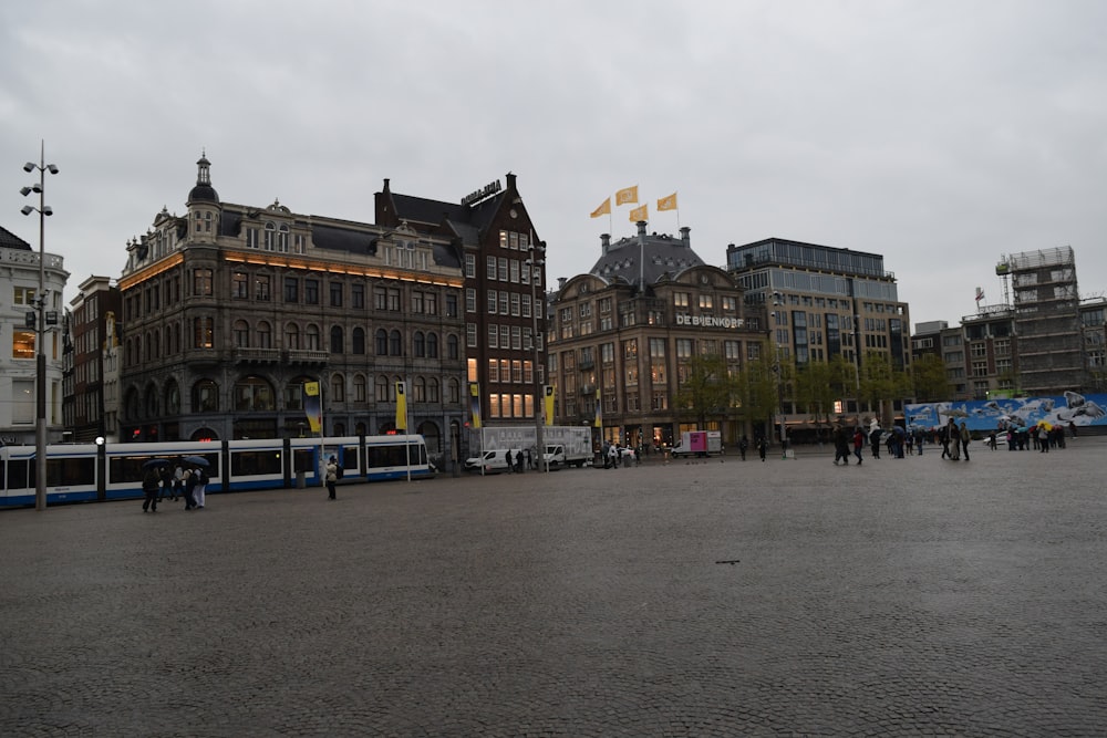 a group of people walking around a city