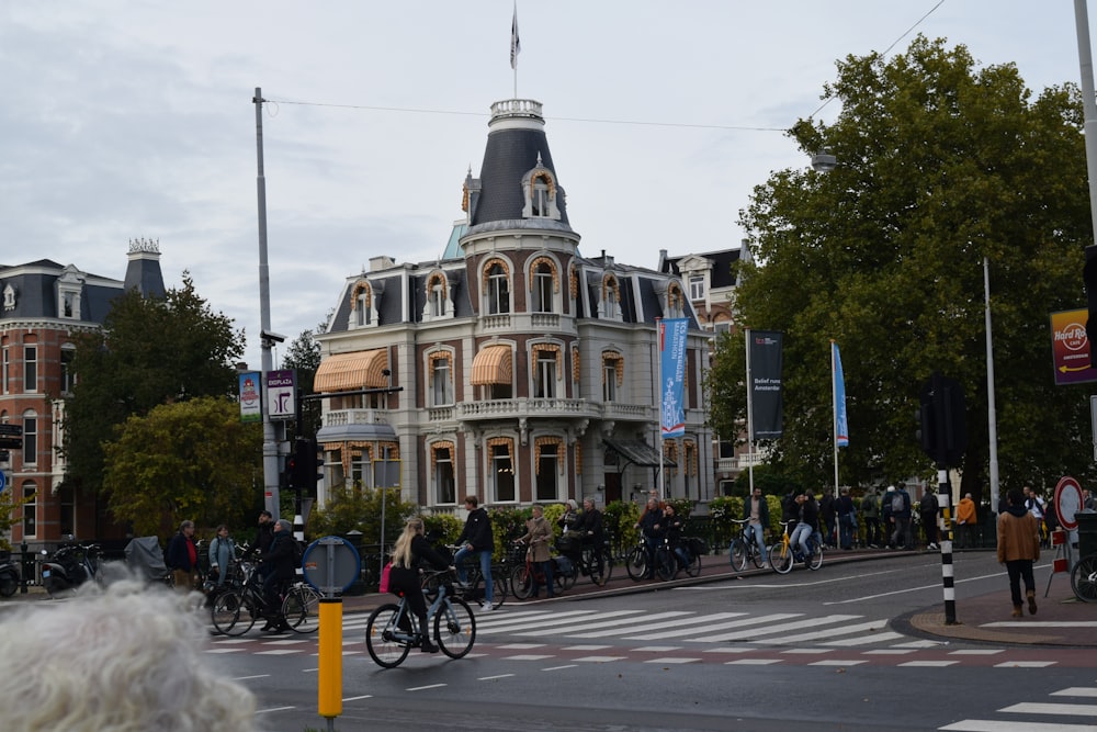 a group of people riding bikes on a street