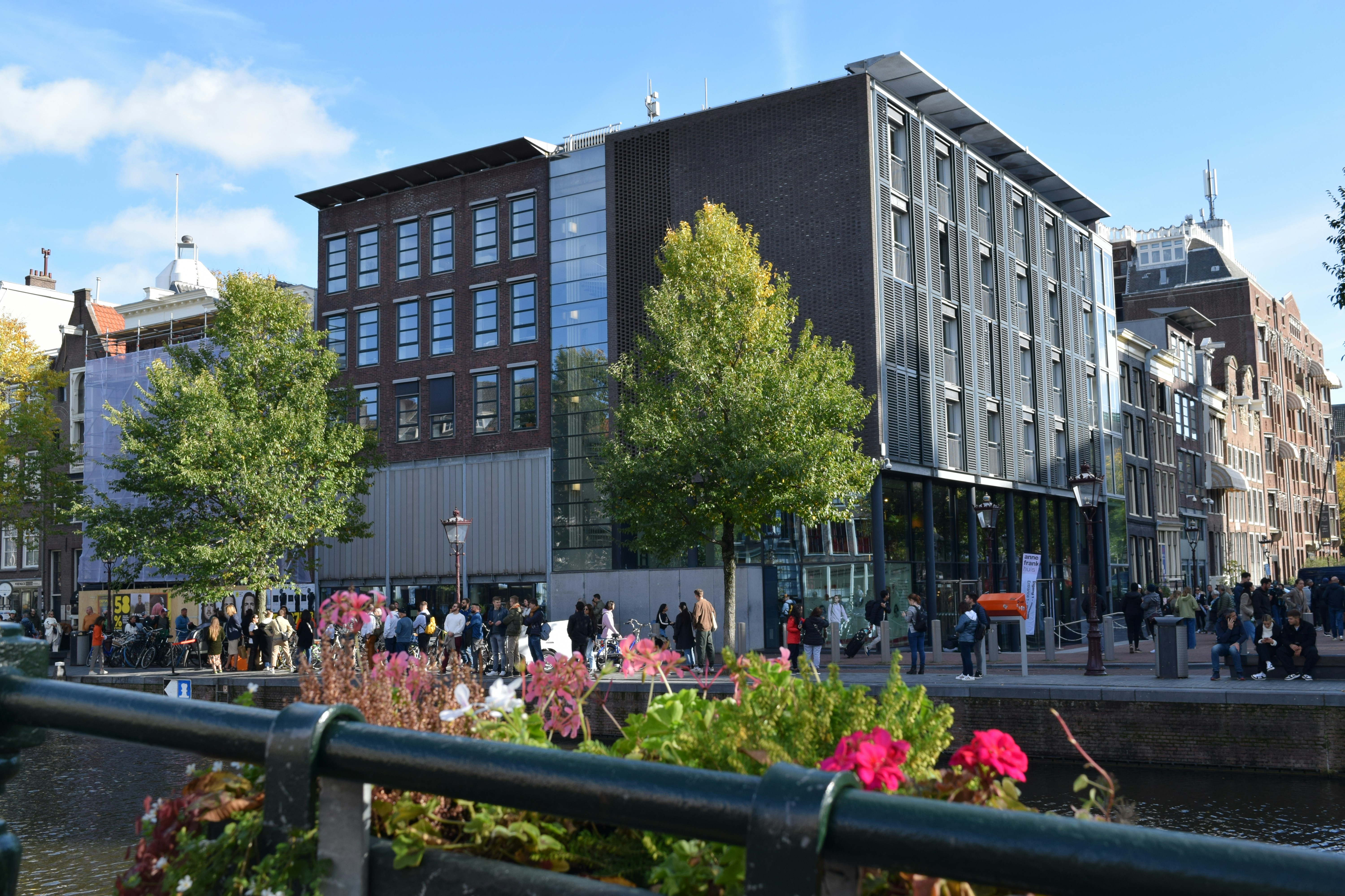 Anne Frank House with a group of people walking around