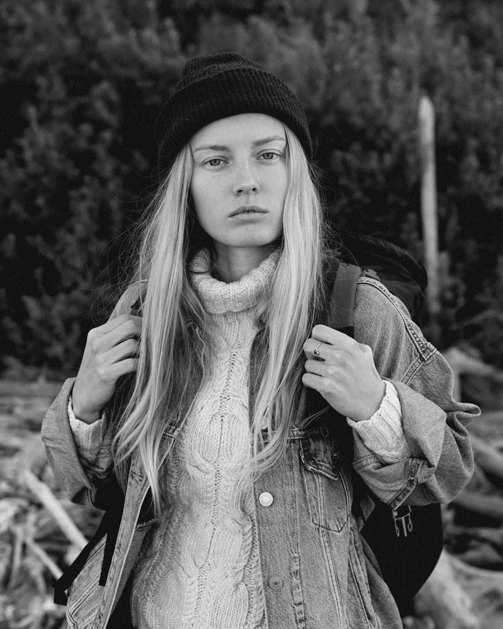 a woman with long hair and a hat