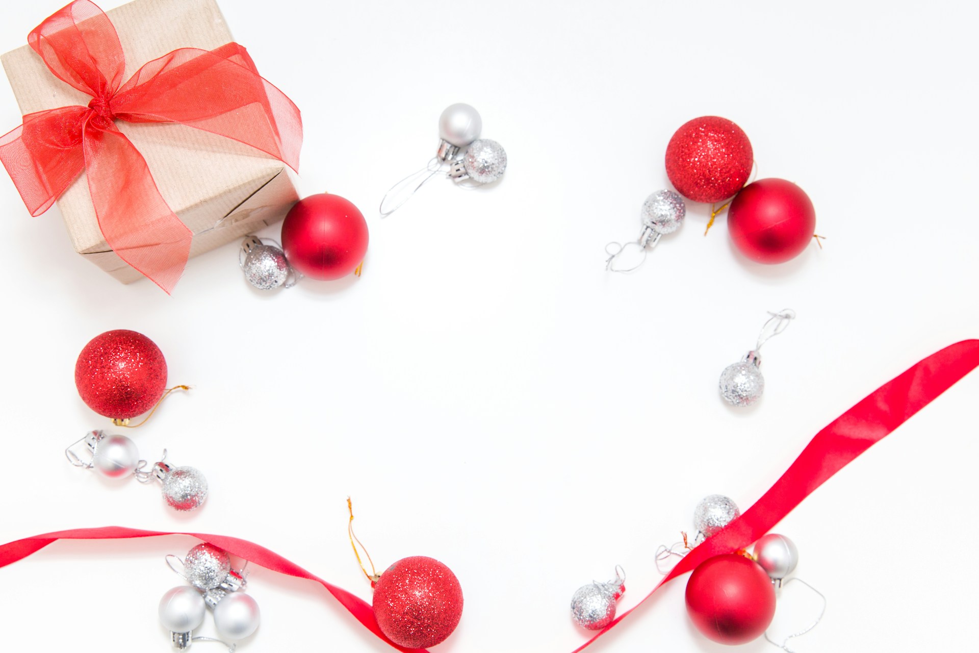 a group of red and white necklaces