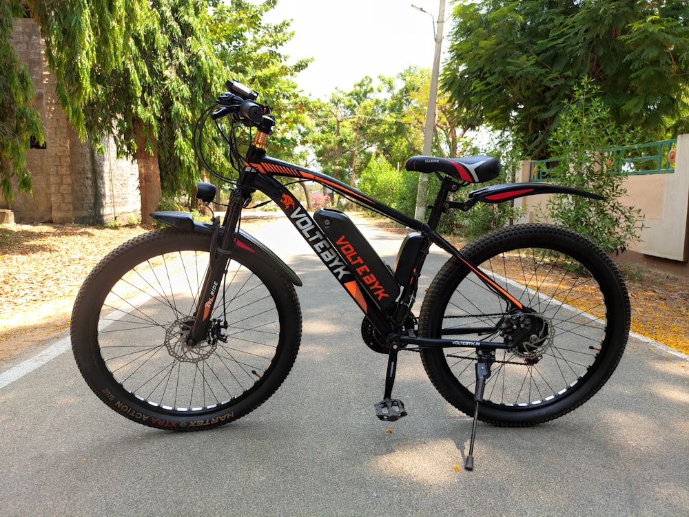 a black bicycle parked on a street