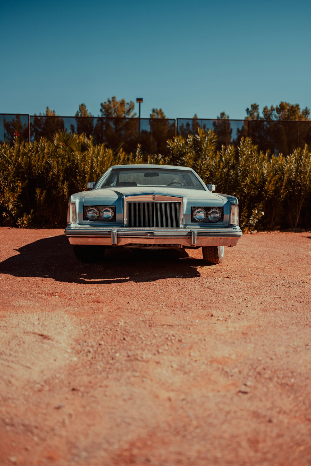a car parked on a dirt road