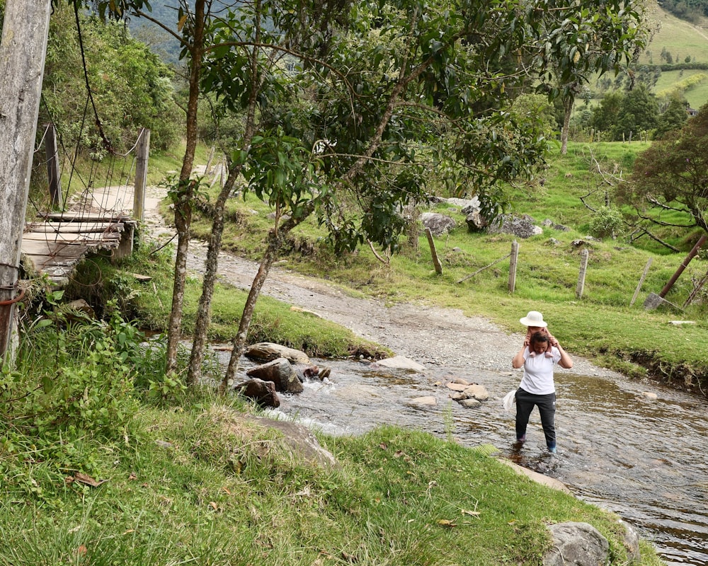 a person standing in a stream