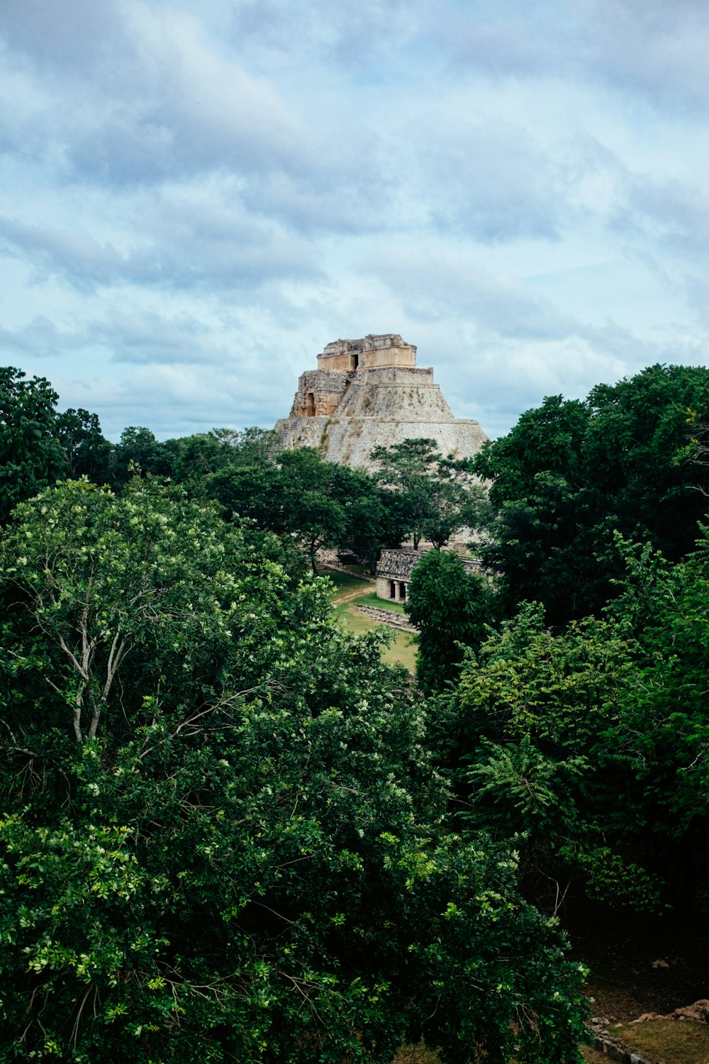 a stone castle on a hill