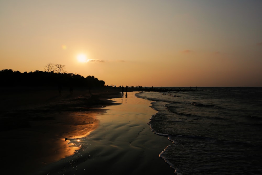 a beach with a sunset