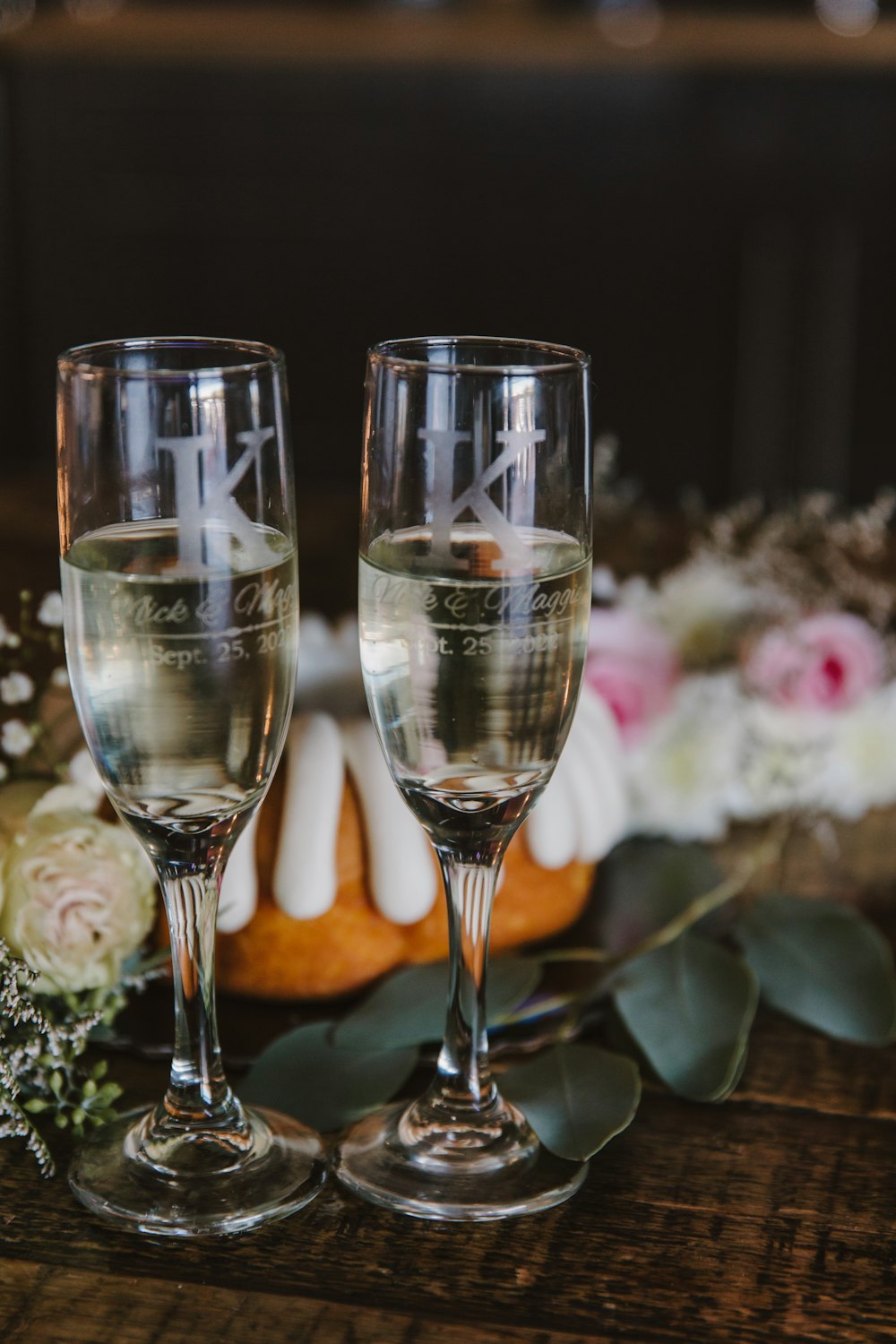 two glasses of champagne on a table