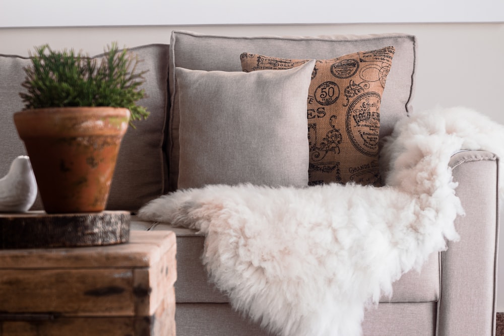 a white couch with a white pillow