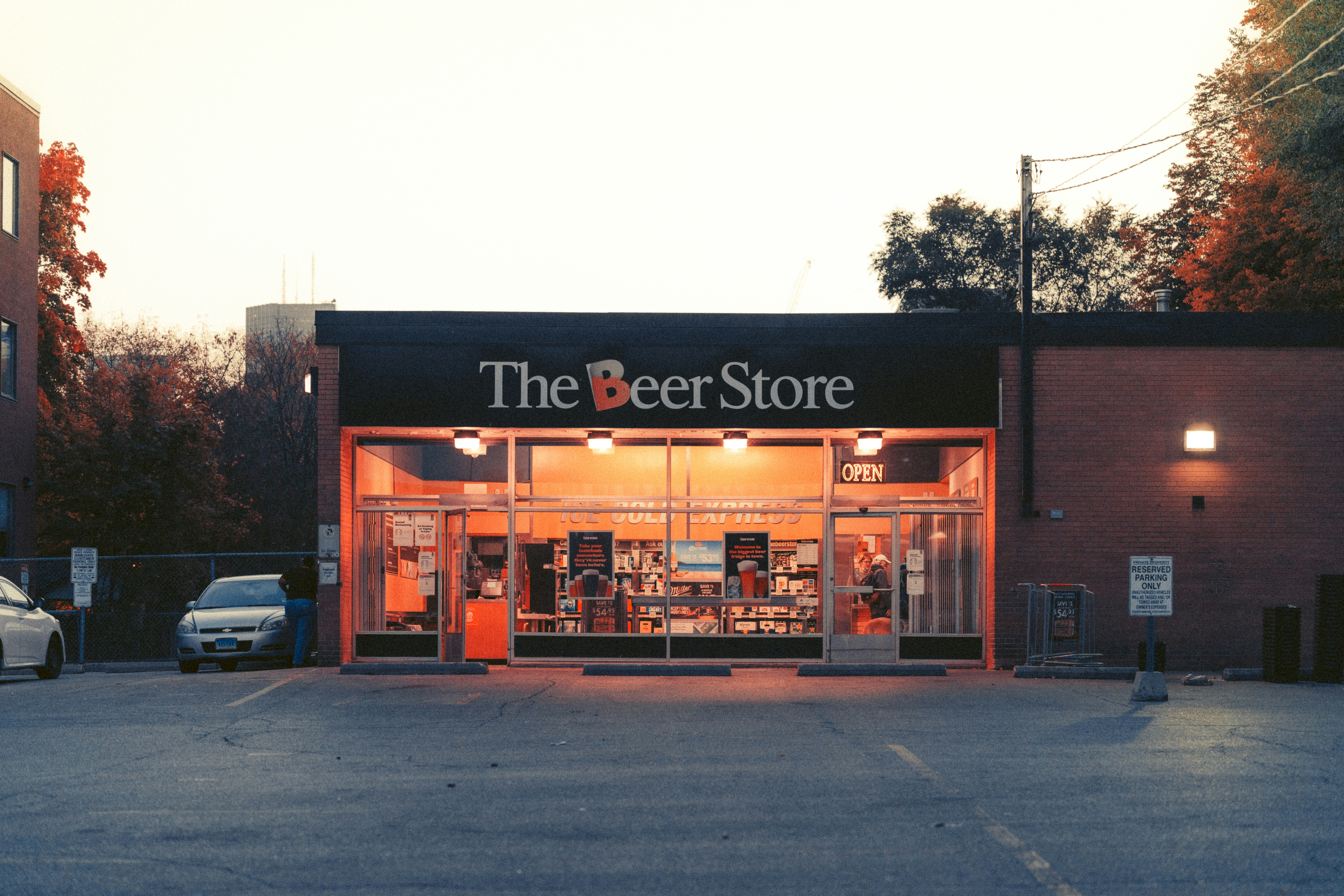 a store front with a parking lot