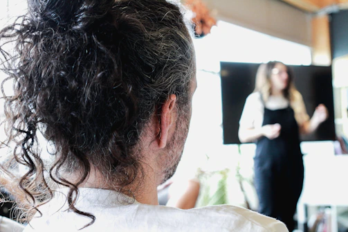 Close-up of a speaker passionately explaining a concept to an attentive audience.
