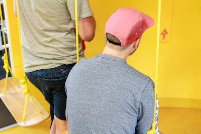 a man wearing a pink hat
