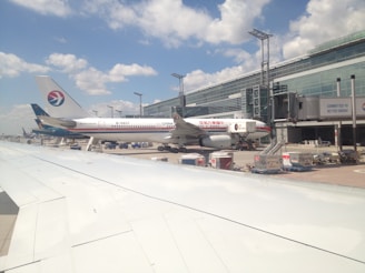 a couple of airplanes at an airport