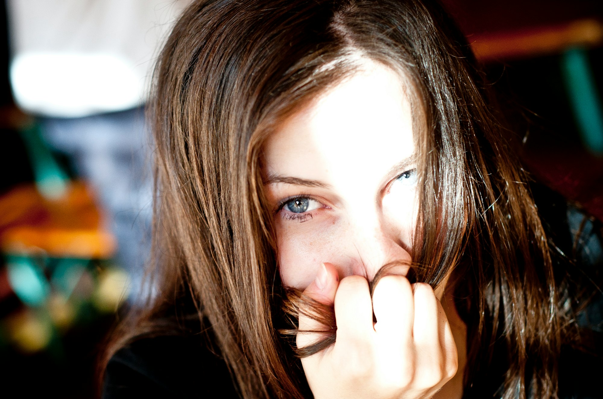 a woman with her hand on her face