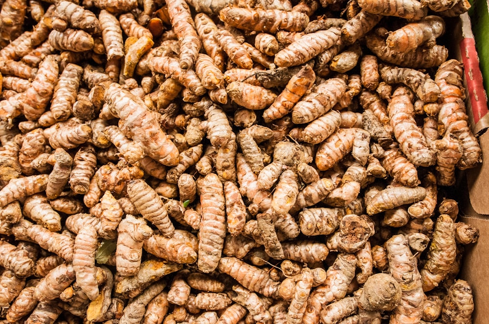 a pile of brown and white nuts