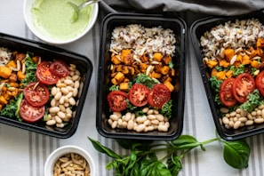 a group of trays with food