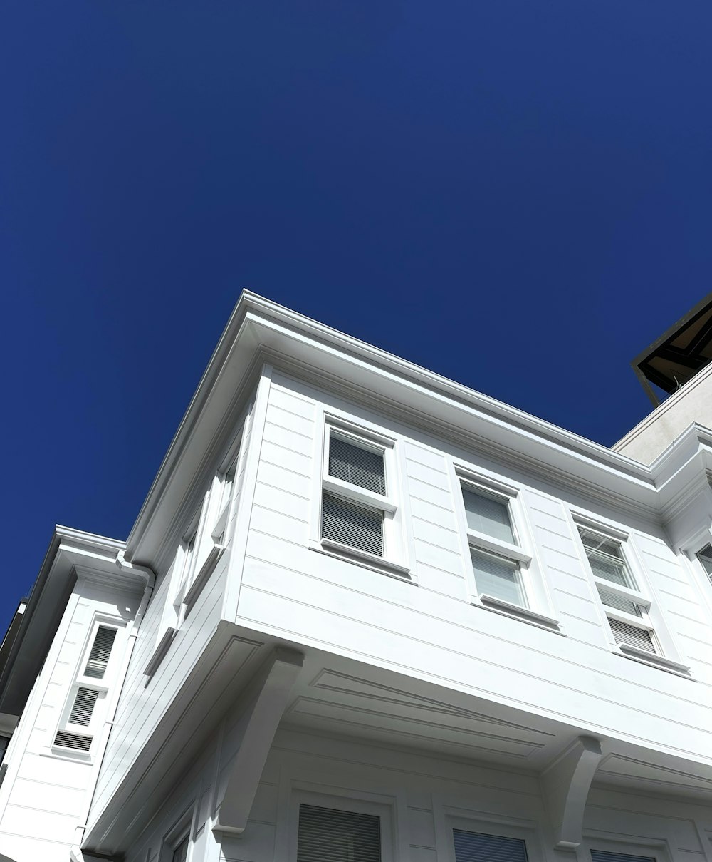 a white building with a blue sky