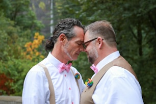 a couple of men kissing