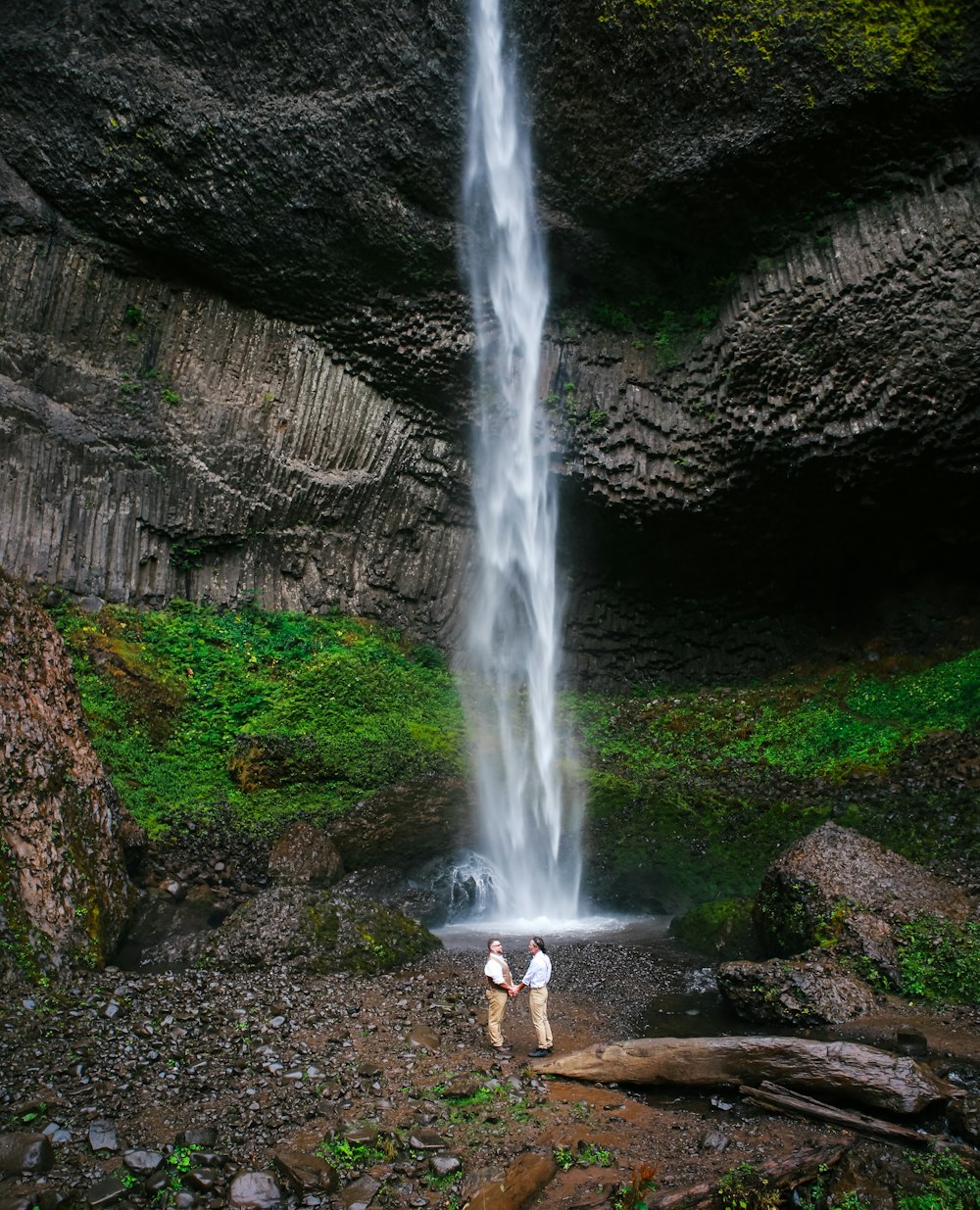 a couple of people standing in front of Silver Falls State Park