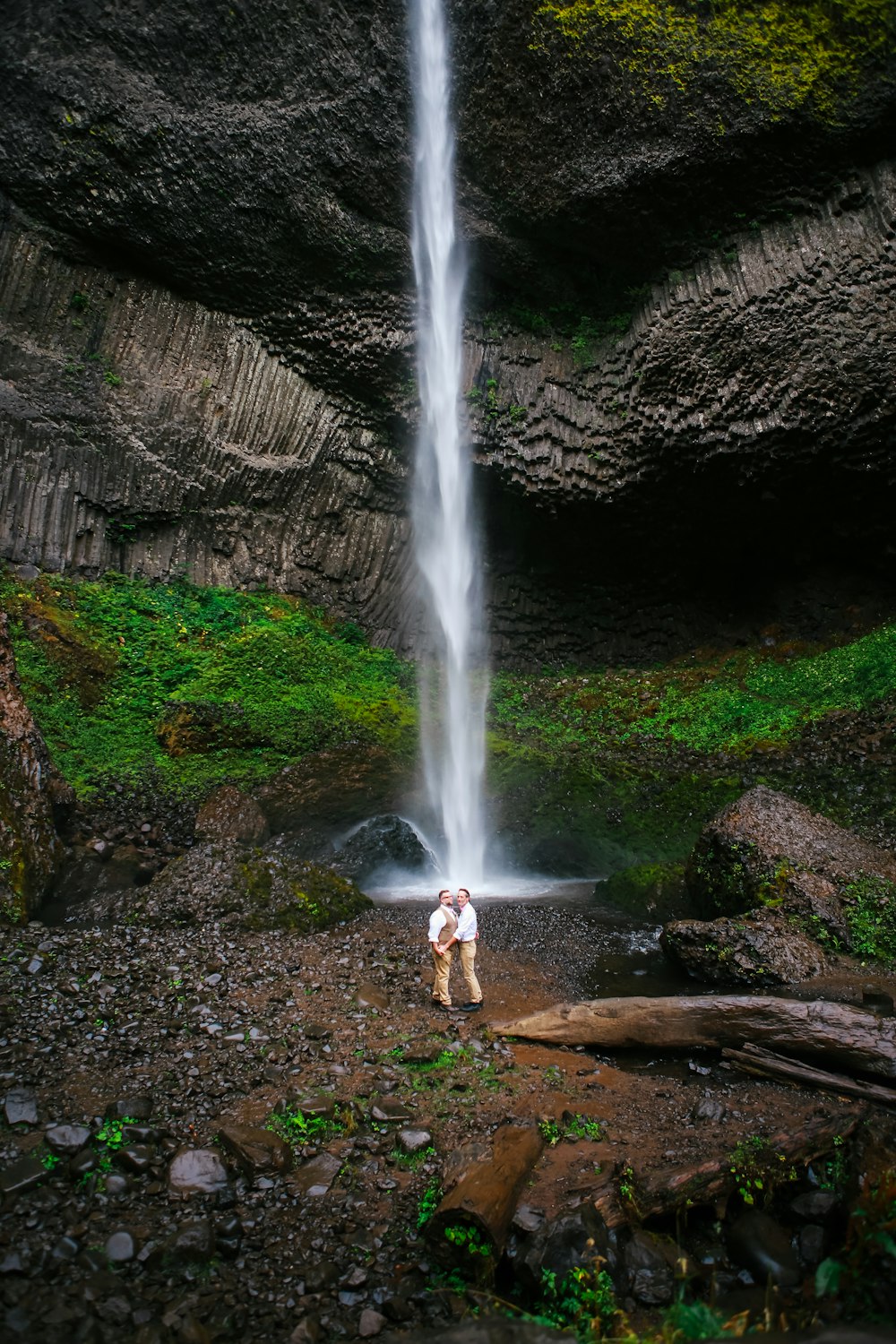 a couple of people standing in front of Silver Falls State Park