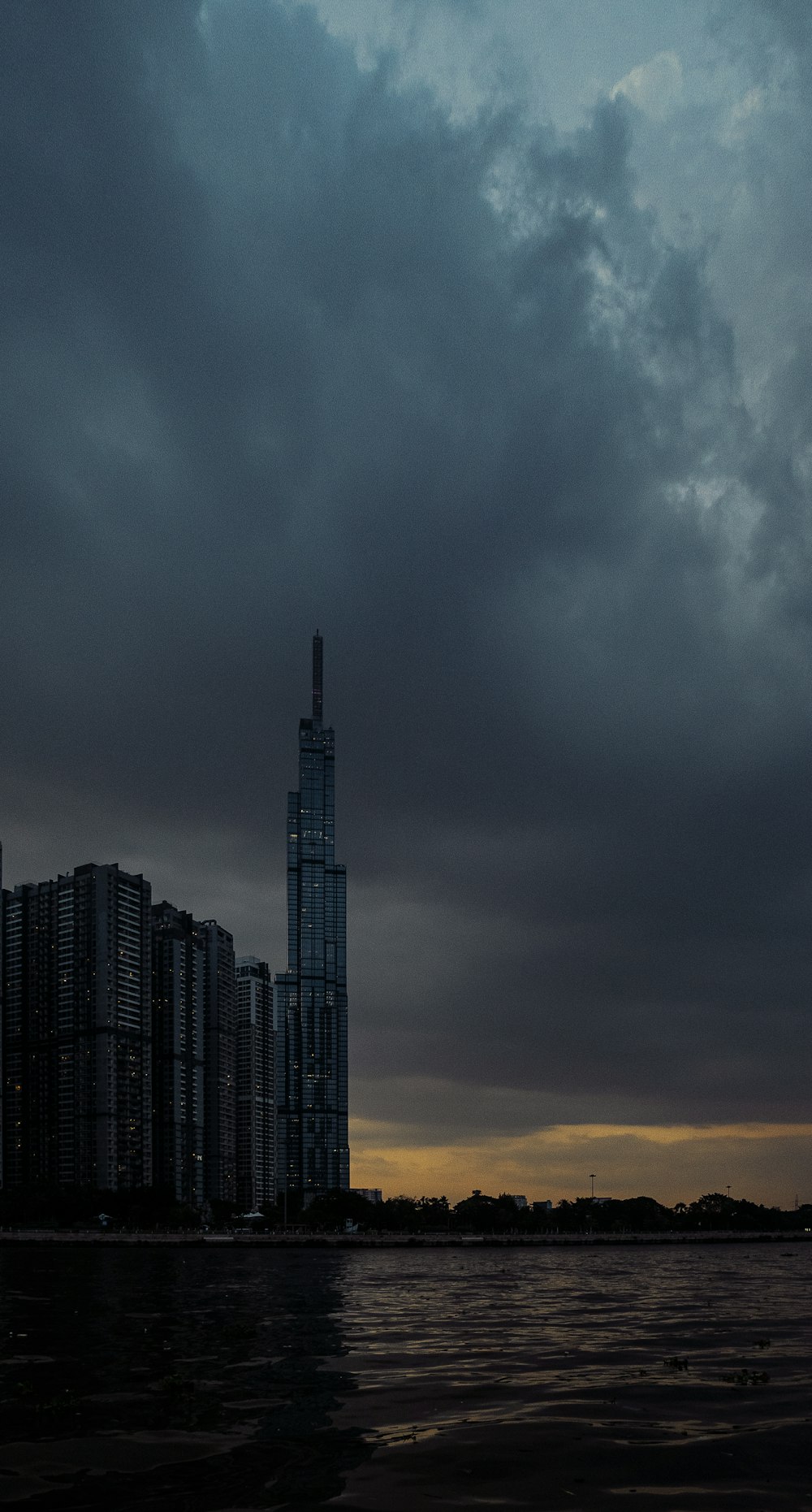 a tall building by the water