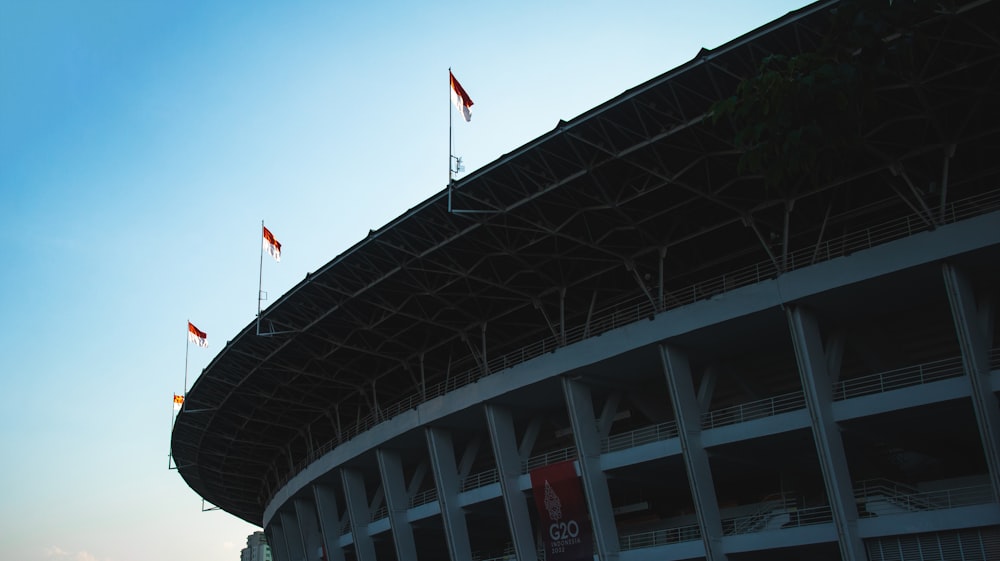 a building with flags on the roof