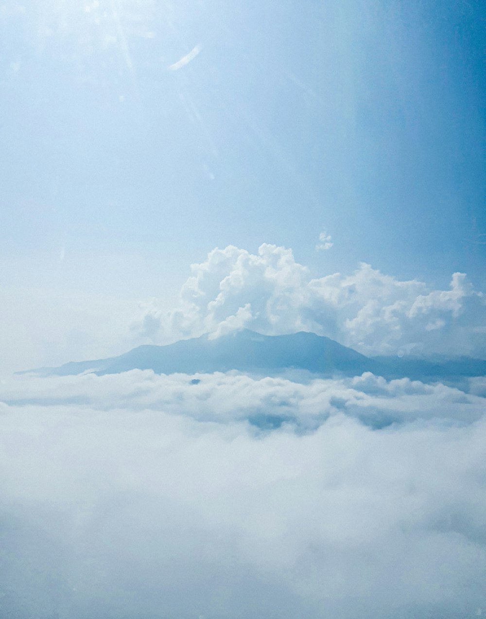 a mountain in the clouds