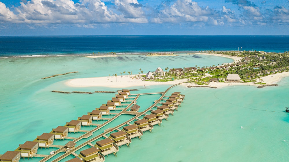 a beach with many buildings and water