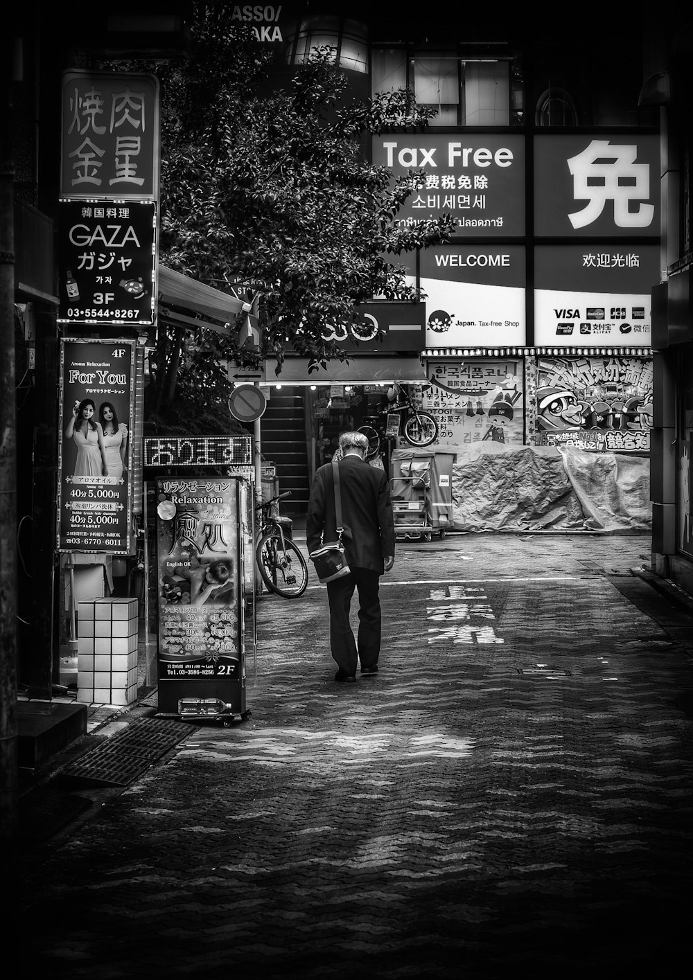 a person standing in front of a storefront