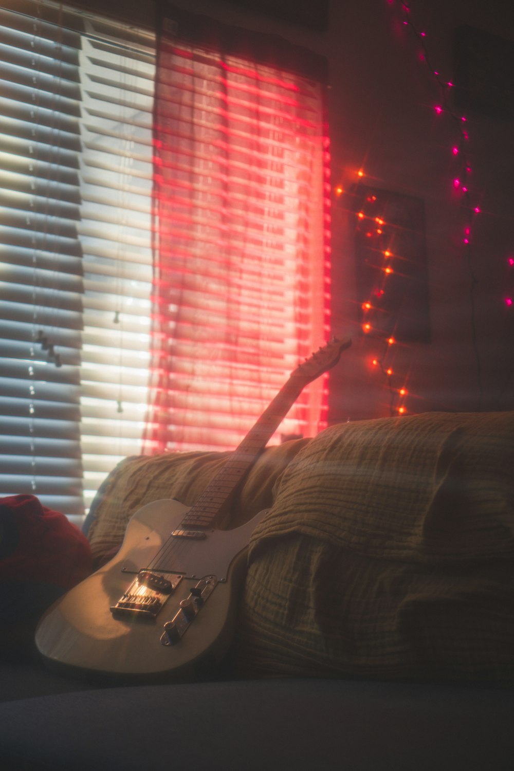 a person lying on a couch with their arms up in the air