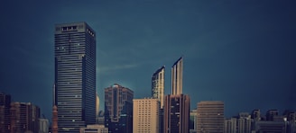 A sleek, minimalist office skyline at dusk evoking calm professionalism and global reach.