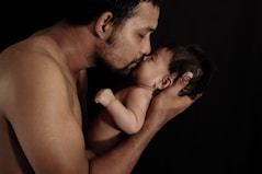 a man and woman kissing