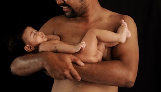 a man holding a baby