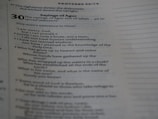 A photograph of a page from a book, showing text from Proverbs 30 in the Bible. The text is focused on the 'Sayings of Agur' with verses detailing reflections on weariness, understanding, wisdom, and rhetorical questions about divine power.