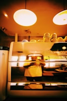 Photo of a casual meeting with a client discussing automation solutions over coffee.