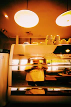 A futuristic AI kiosk blending seamlessly into the café ambiance.