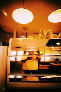 Photo of a casual meeting with a client discussing automation solutions over coffee.