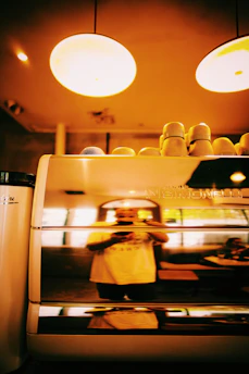 A futuristic AI kiosk blending seamlessly into the café ambiance.