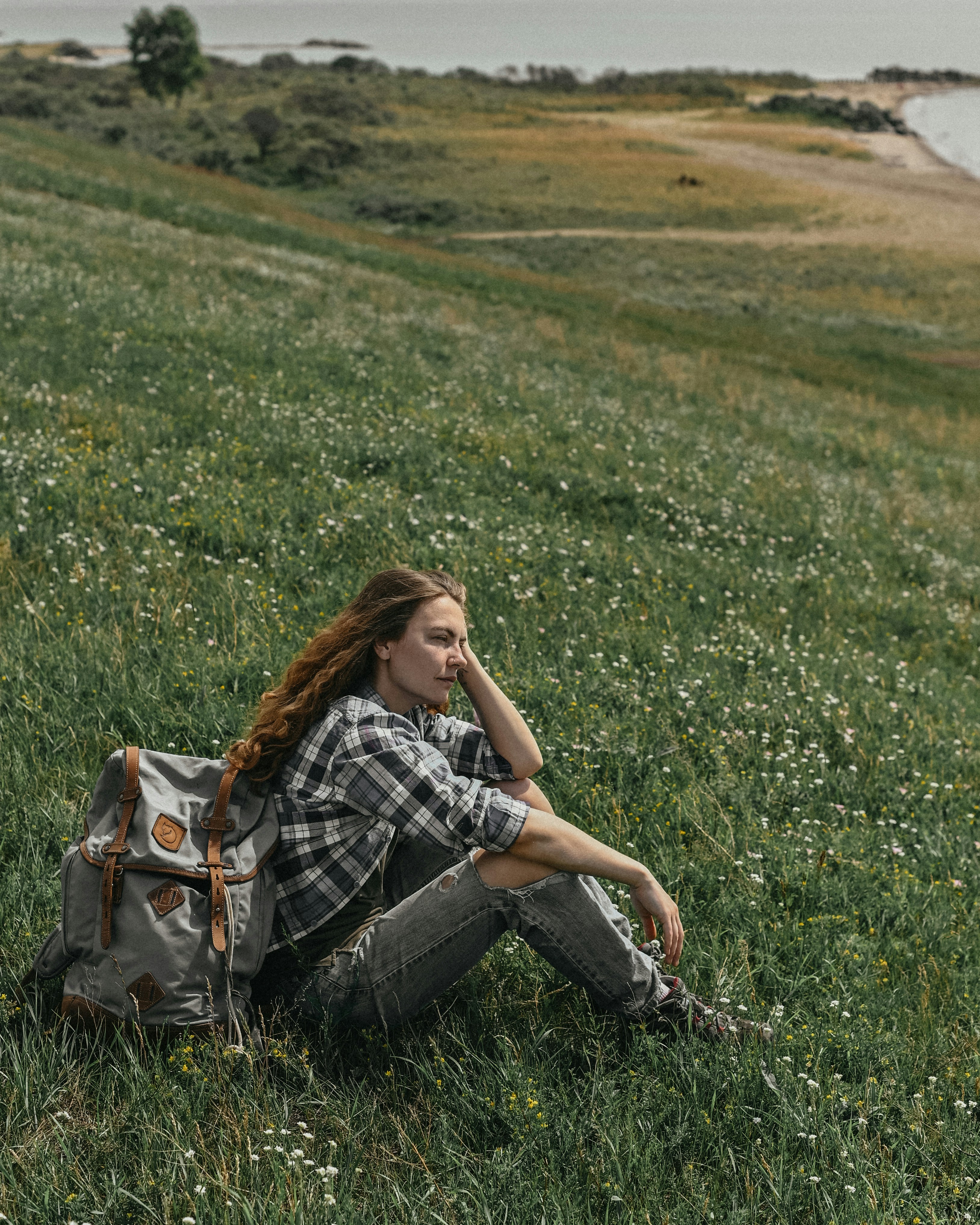 a person sitting in a field