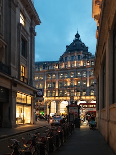 a street with buildings and bicycles