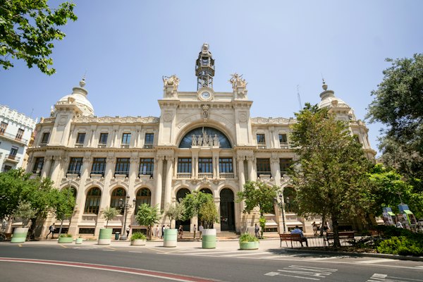 A large building with a statue on top — Valencia, Spain