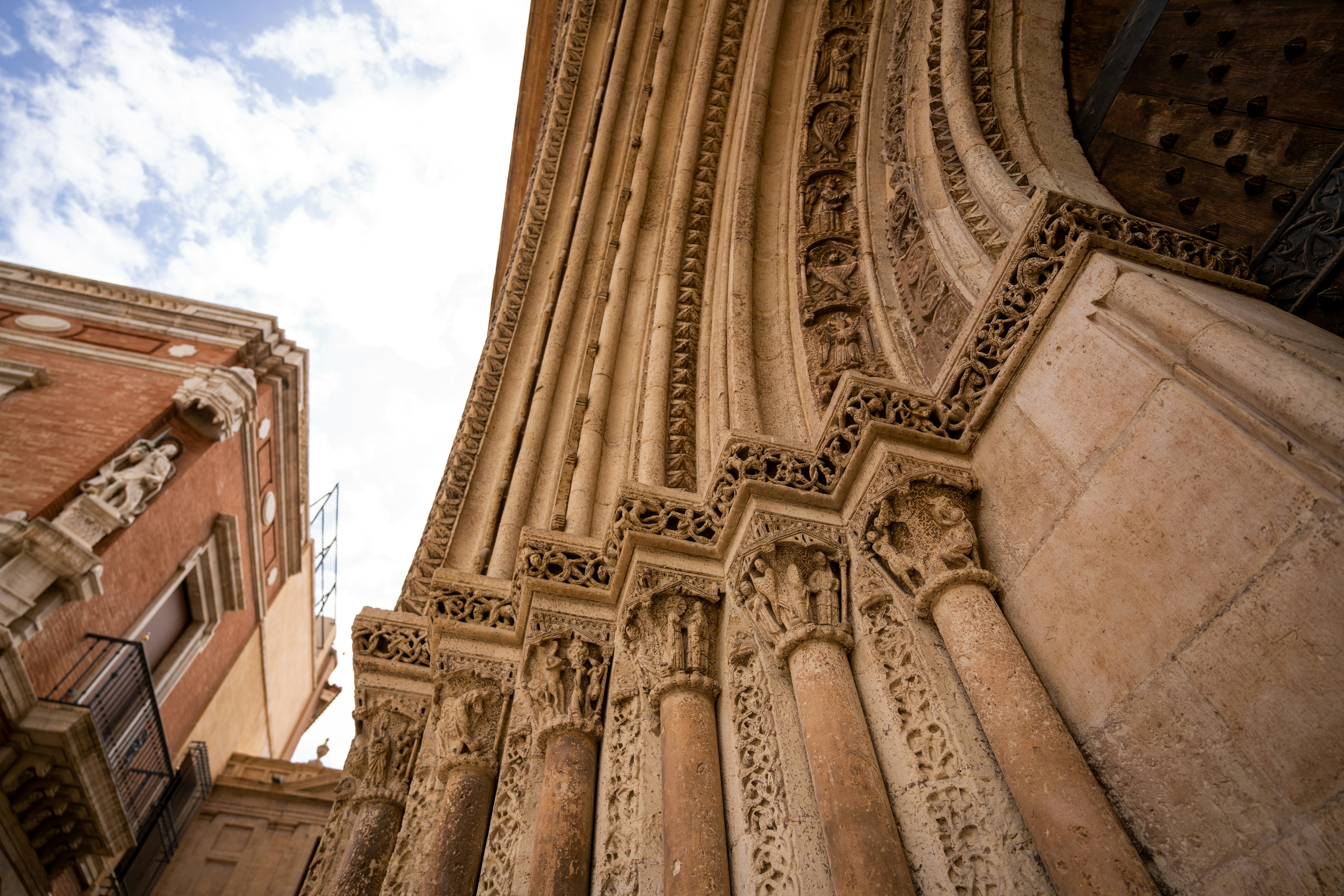 a building with a large archway, Valencia Cathedral architectural details. If you used the photograph we would love if you could mention https://en.northleg.com/