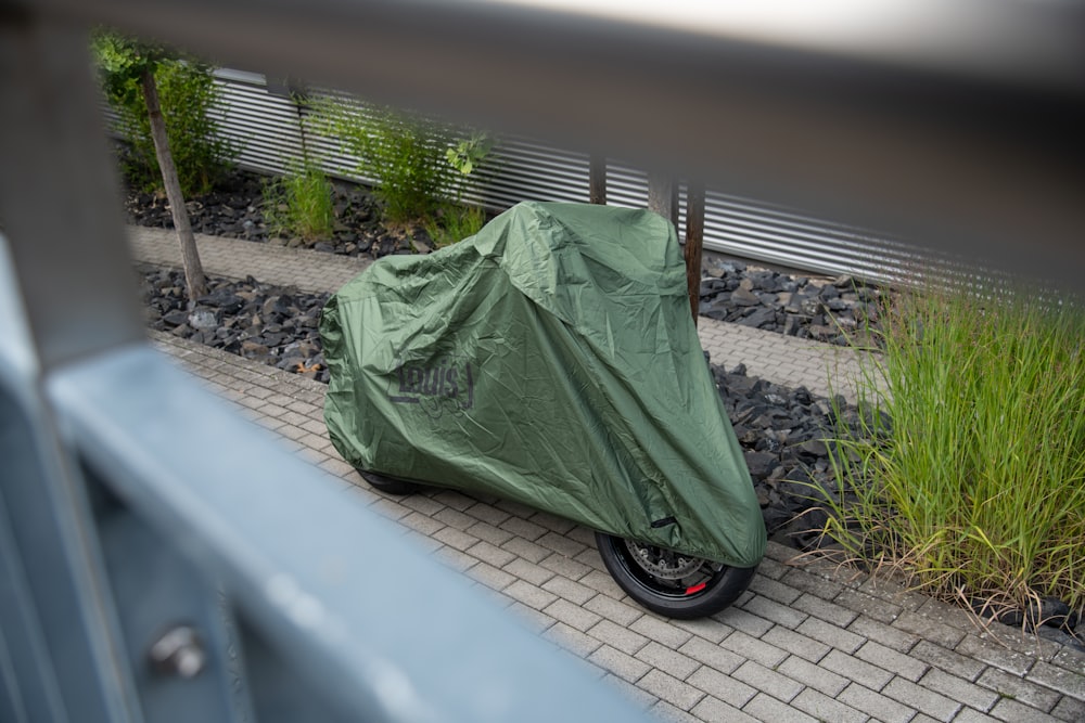 a green tarp on a car