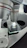 Close-up of a scientist examining a microscope slide in a bright laboratory.
