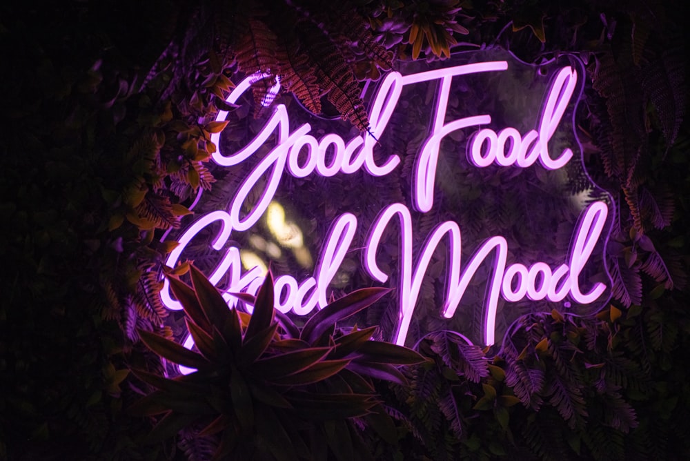 a neon sign with purple text