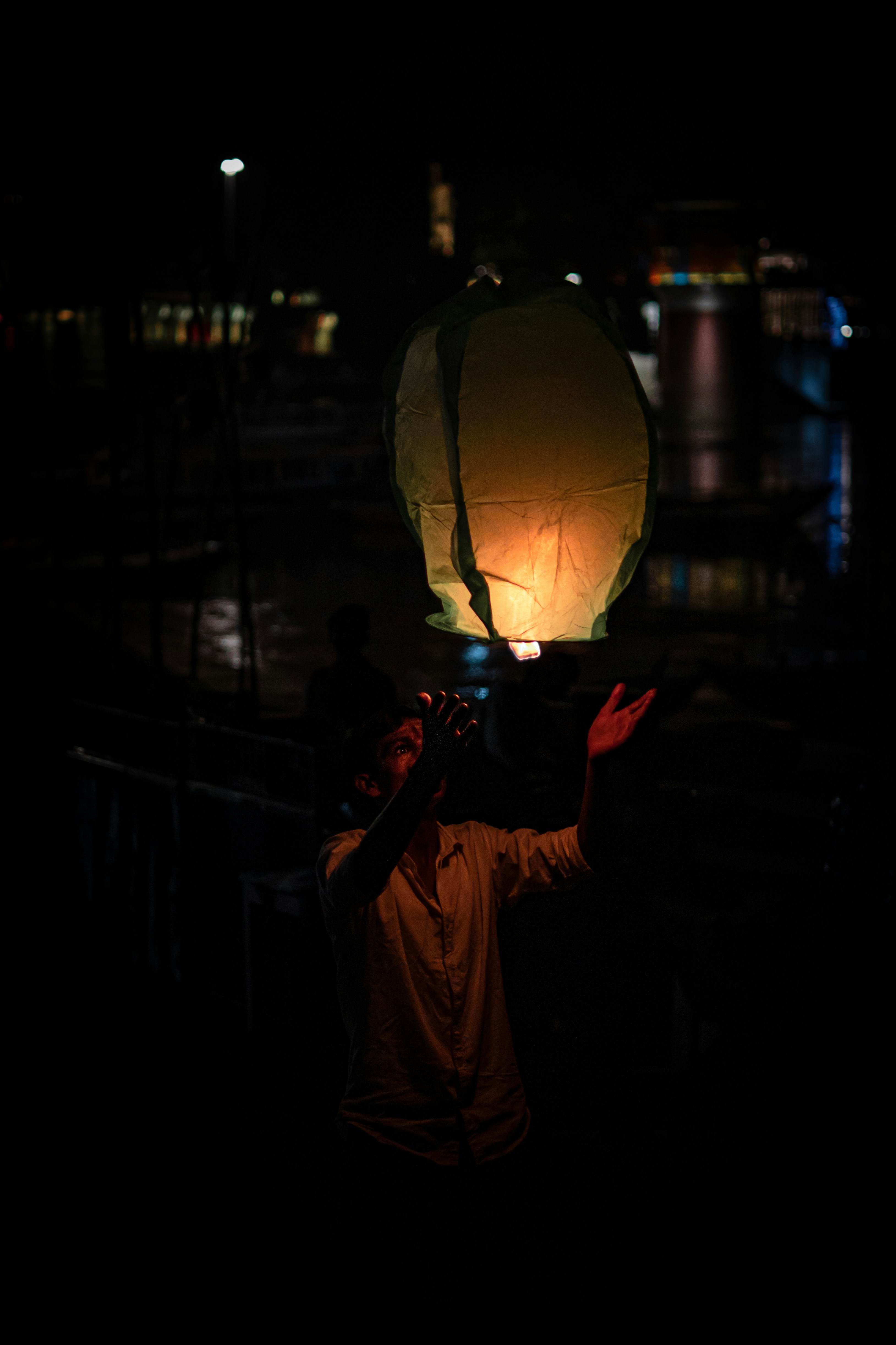 a man holding a light up to his face