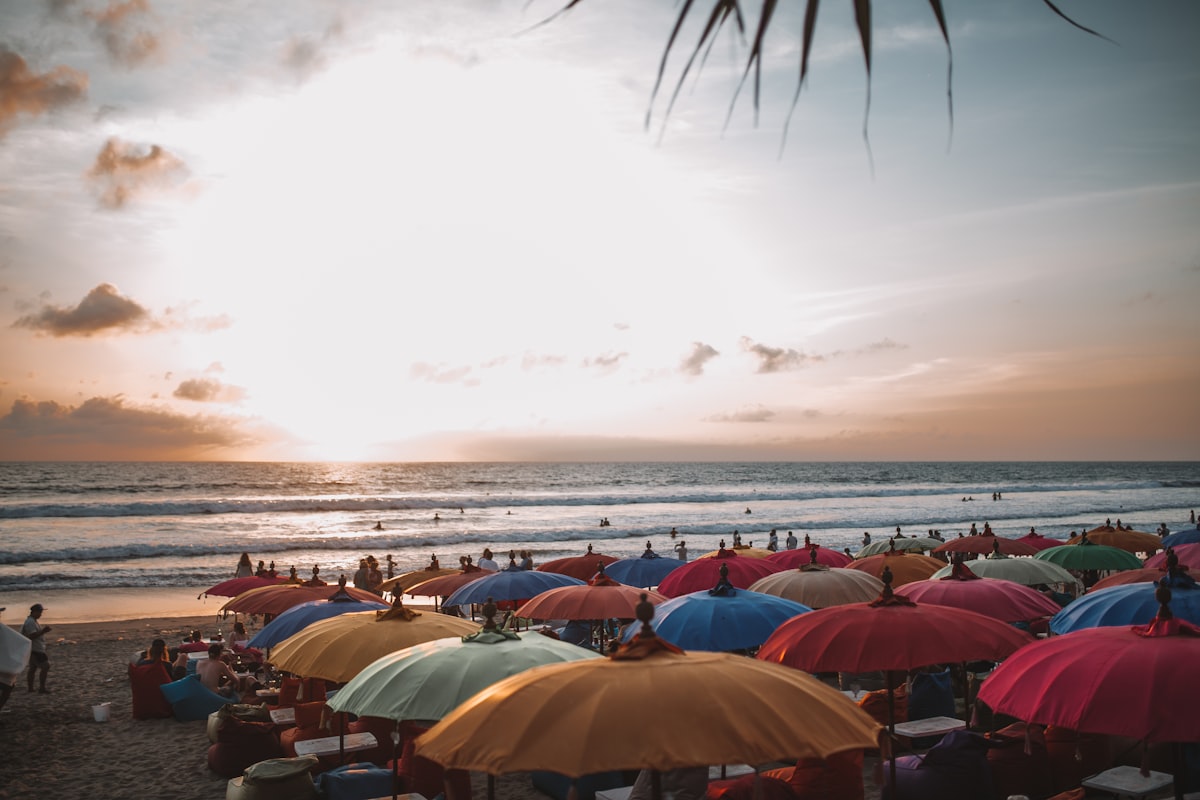 a beach is filled with umbrellas