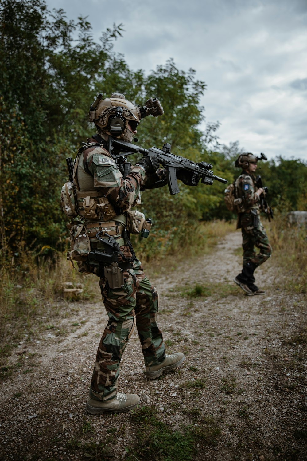 a couple of soldiers holding guns