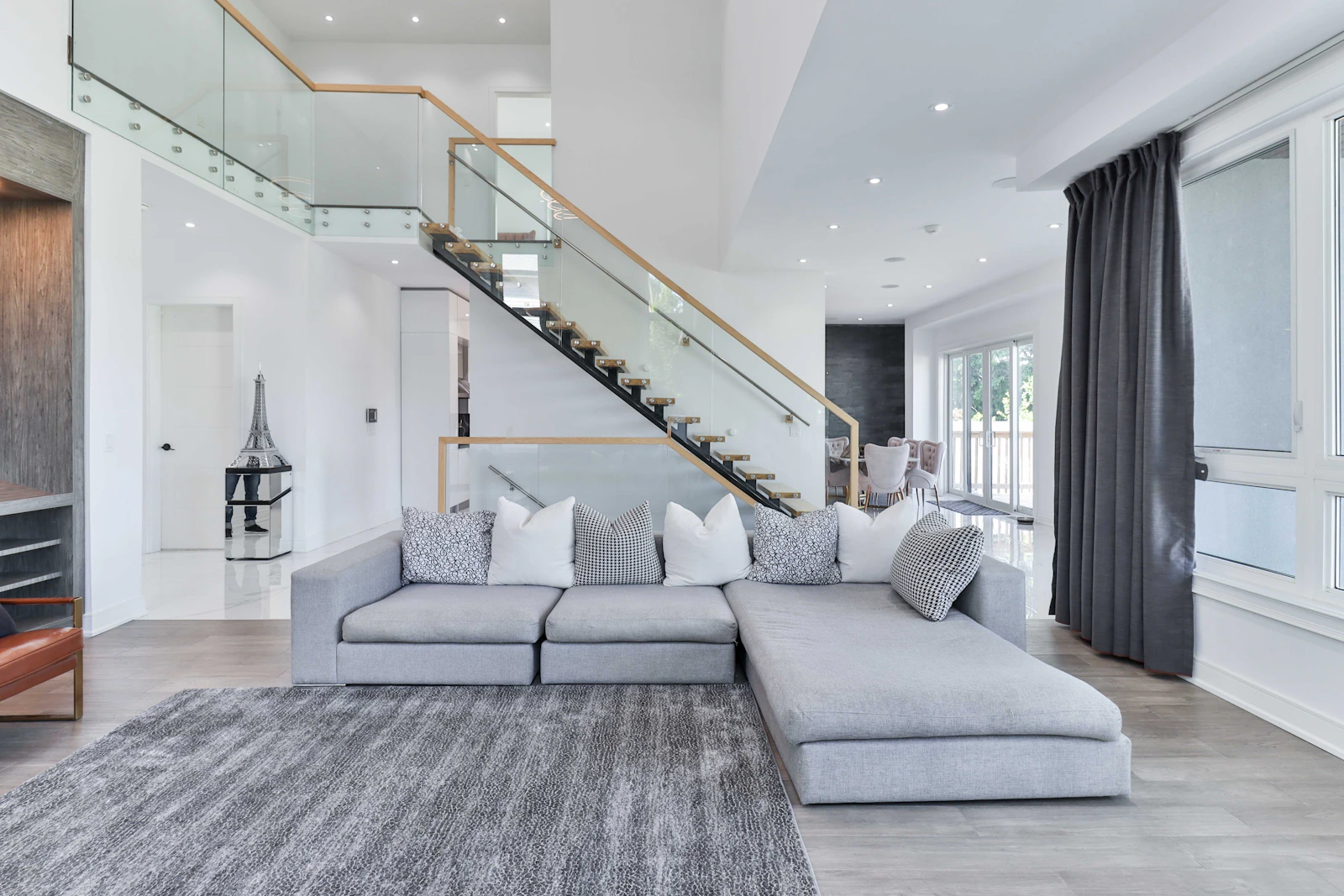 Modern interior with furniture, rug, lighting, and decorative details