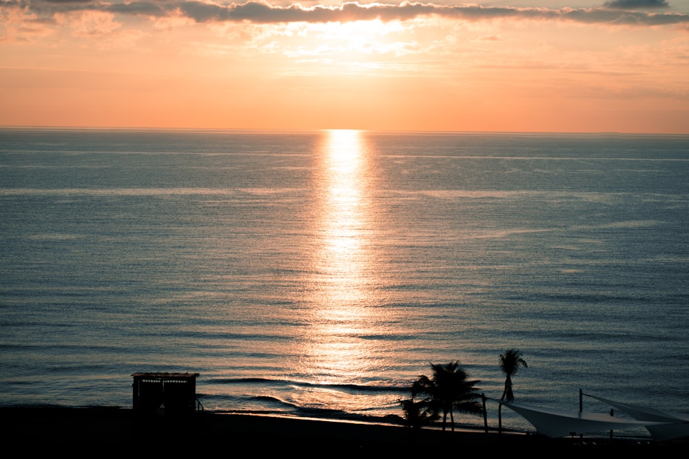 a sunset over a body of water