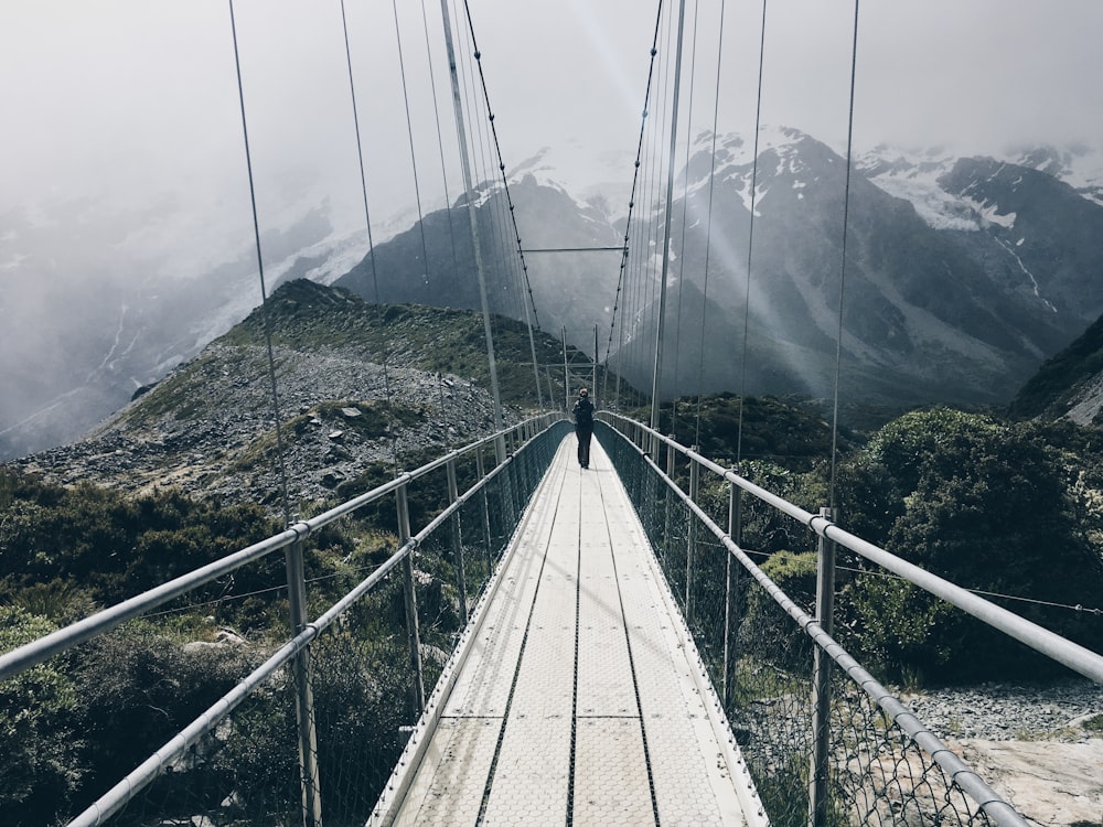 a person walking on a bridge